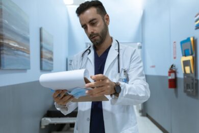 doctor reading a medical chart